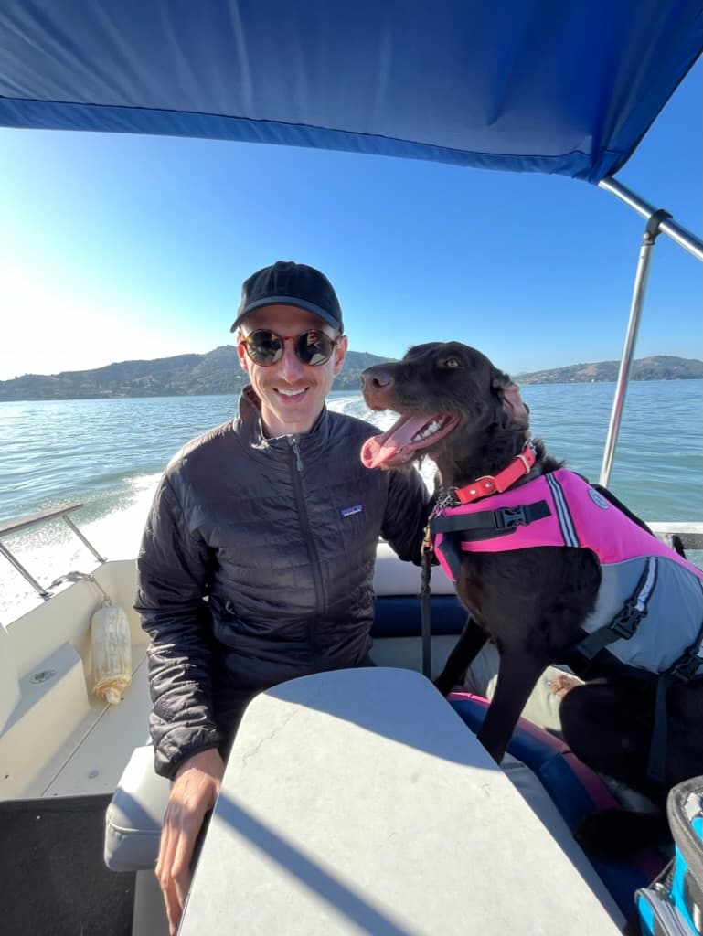 Mara the dog, riding on a boat